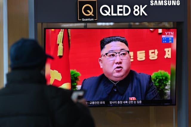 <p>A man watches a television screen showing news footage of North Korean leader Kim Jong Un attending the 8th congress of the ruling Workers' Party held in Pyongyang, at a railway station in Seoul on 6 January 2021</p>