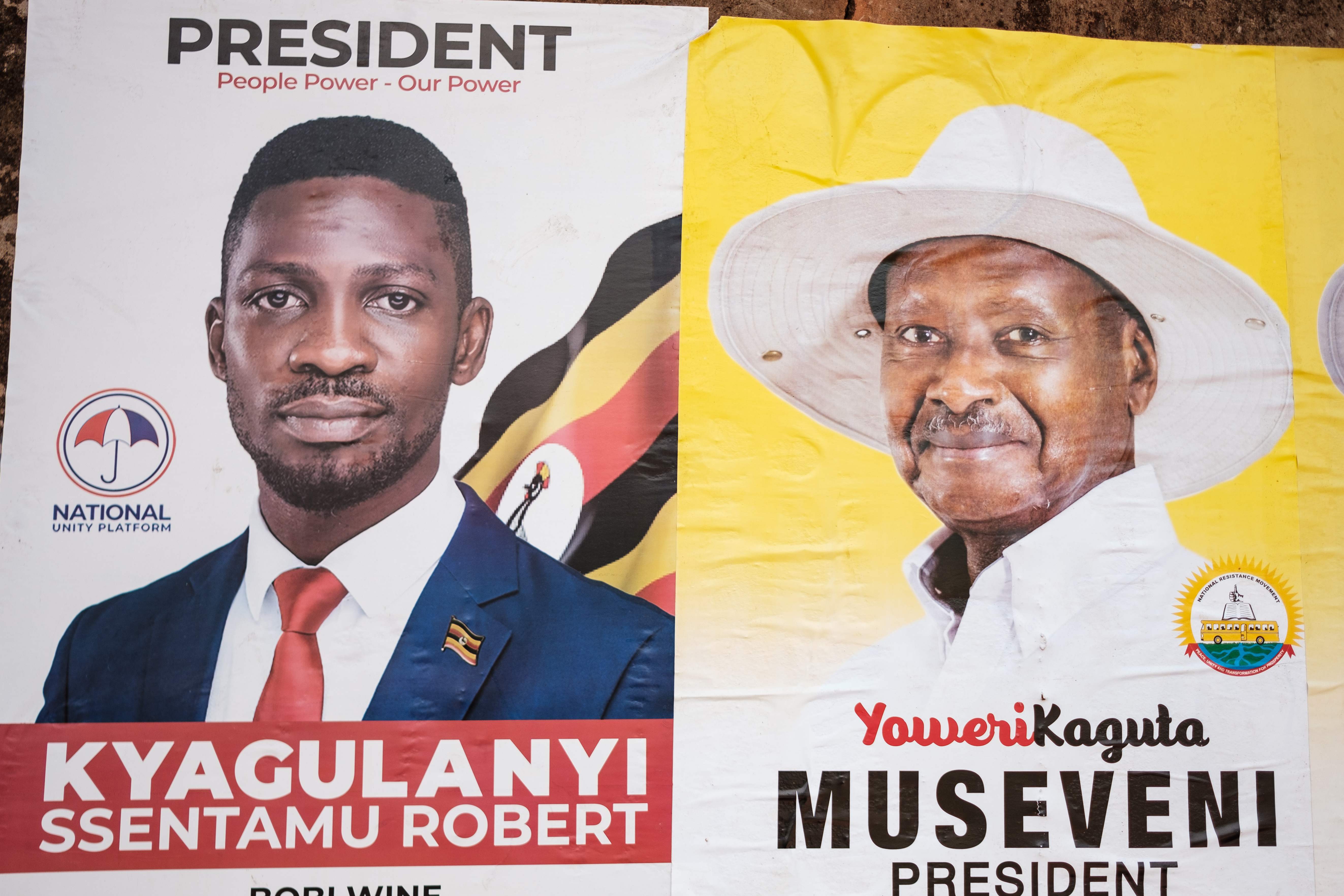 Posters show Bobi Wine (L) and incumbent president Yoweri Museveni (R) ahead of Uganda’s national election on 14 January, 2021.