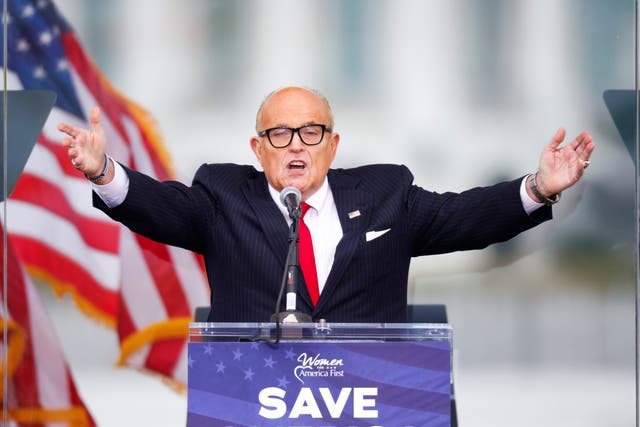 President Donald Trump’s personal lawyer Rudy Giuliani gestures as he speaks as Trump supporters gather by the White House ahead of his speech to contest the certification by the U.S. Congress of the results of the 2020 presidential election in Washington, DC, on 6 January 2021