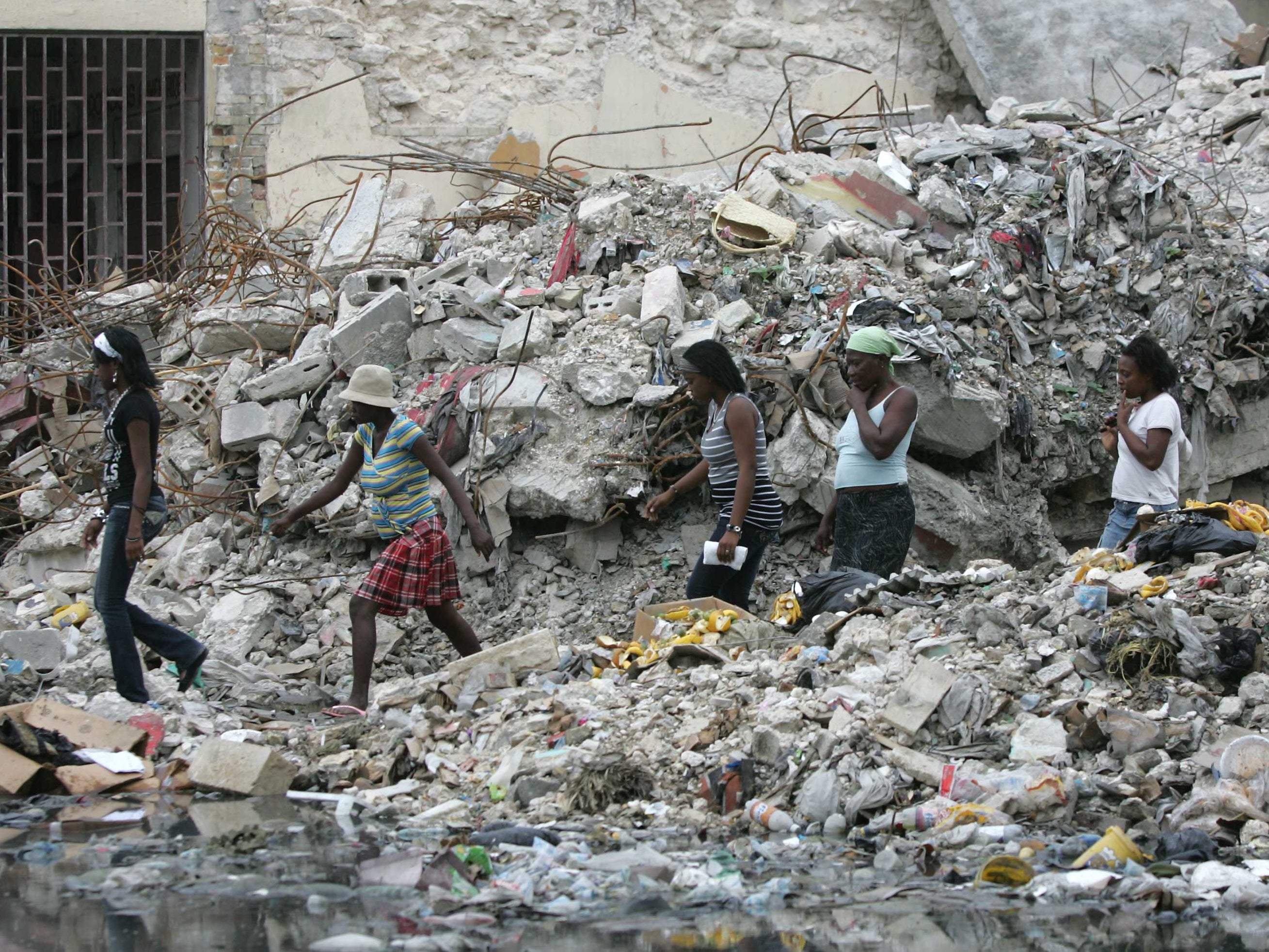 People walk through Port-au-Prince in Haiti after an earthquake on 3 March, 2010.