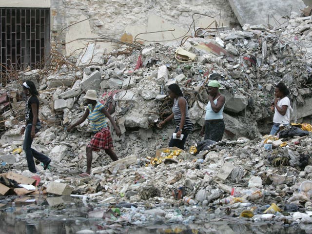 People walk through Port-au-Prince in Haiti after an earthquake on 3 March, 2010. 