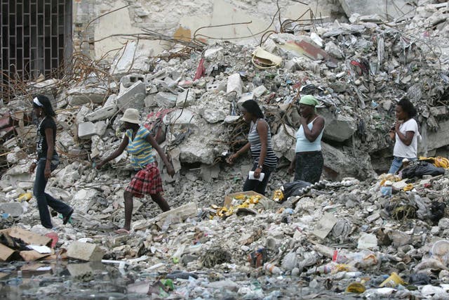 People walk through Port-au-Prince in Haiti after an earthquake on 3 March, 2010. 