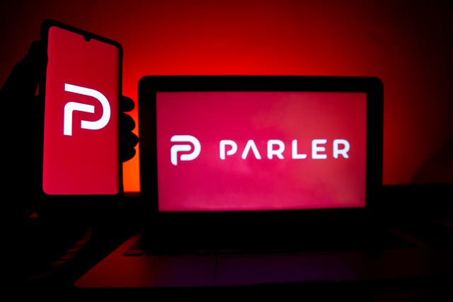 <p>A photo illustration shows the logo of Conservative social media application (app) Parler on a computer and mobile telephone screen, in Paris, France, on 11 January 2021</p>