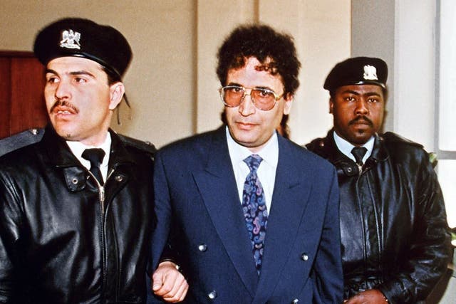 Abdelbaset Ali Mohmet al-Megrahi, later convicted of the Lockerbie bombing, is escorted by security officers on 18 February, 1992. 