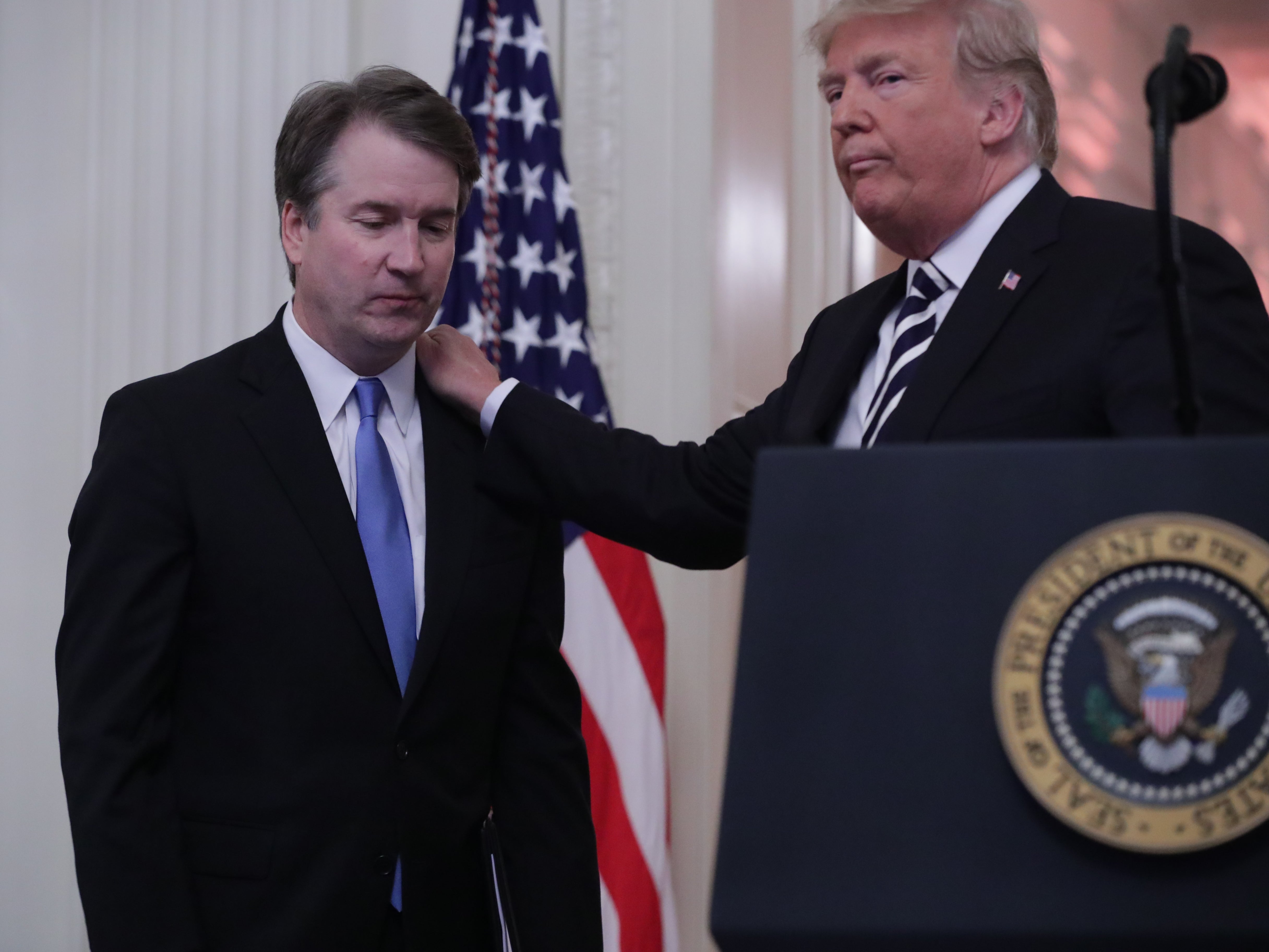 US Supreme Court Justice Brett Kavanaugh is greeted by President Donald Trump at the justice’s ceremonial swearing-in, 8 October, 2018