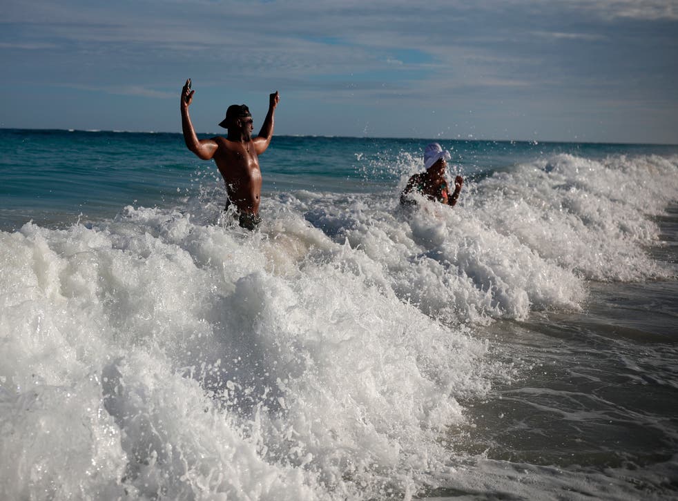 <p>Tourists in the sea in Tulum, Quintana Roo state, earlier this month</p>