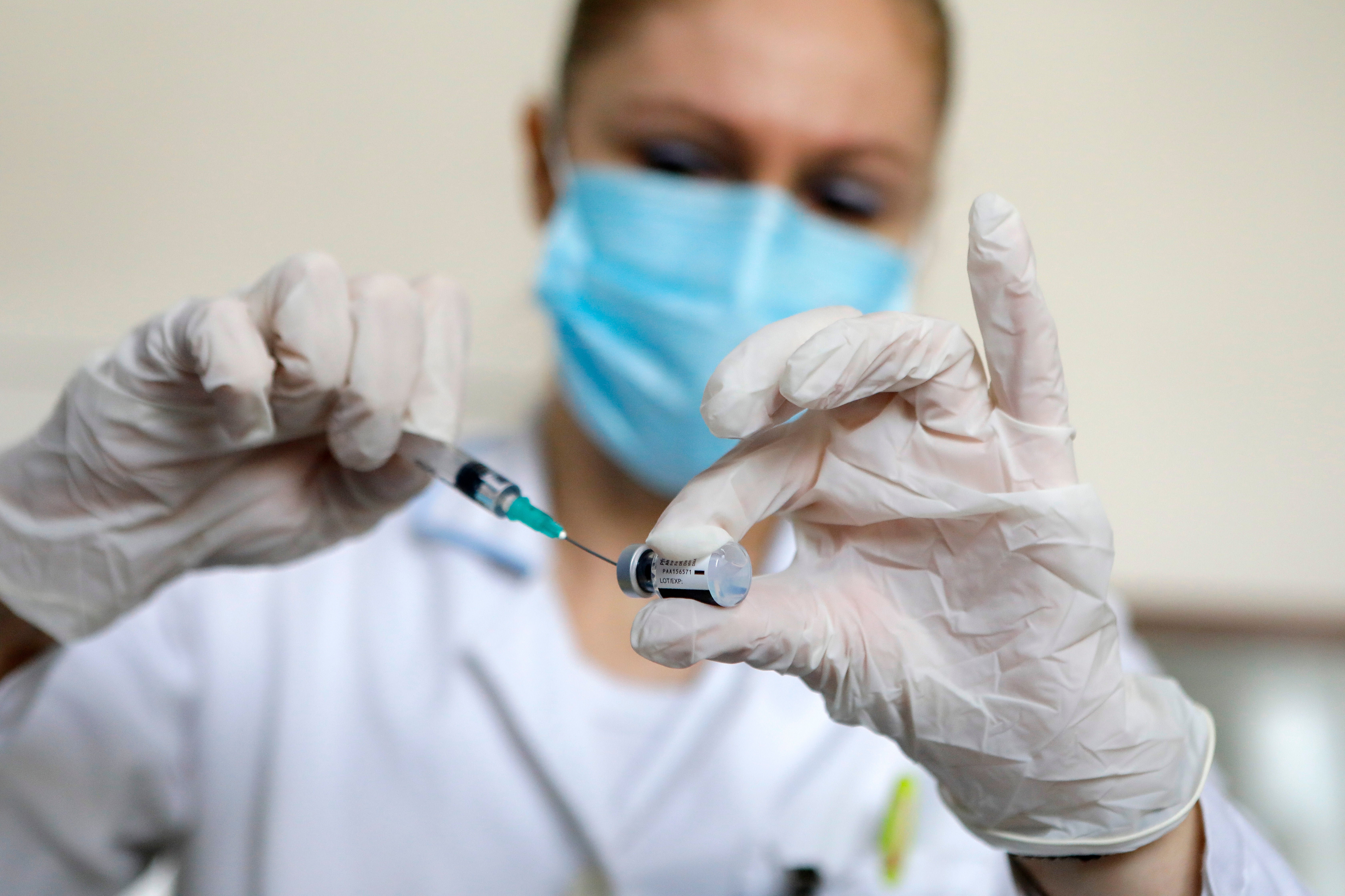 A nurse prepares a dose of Pfizer-BioNTech vaccine at Novi Beograd medical center in Belgrade, Serbia