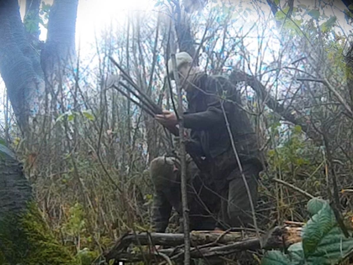 Hunt men caught on film using dog and rods to flush out fox