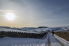 Snow settles across UK as Met Office issues weather warnings