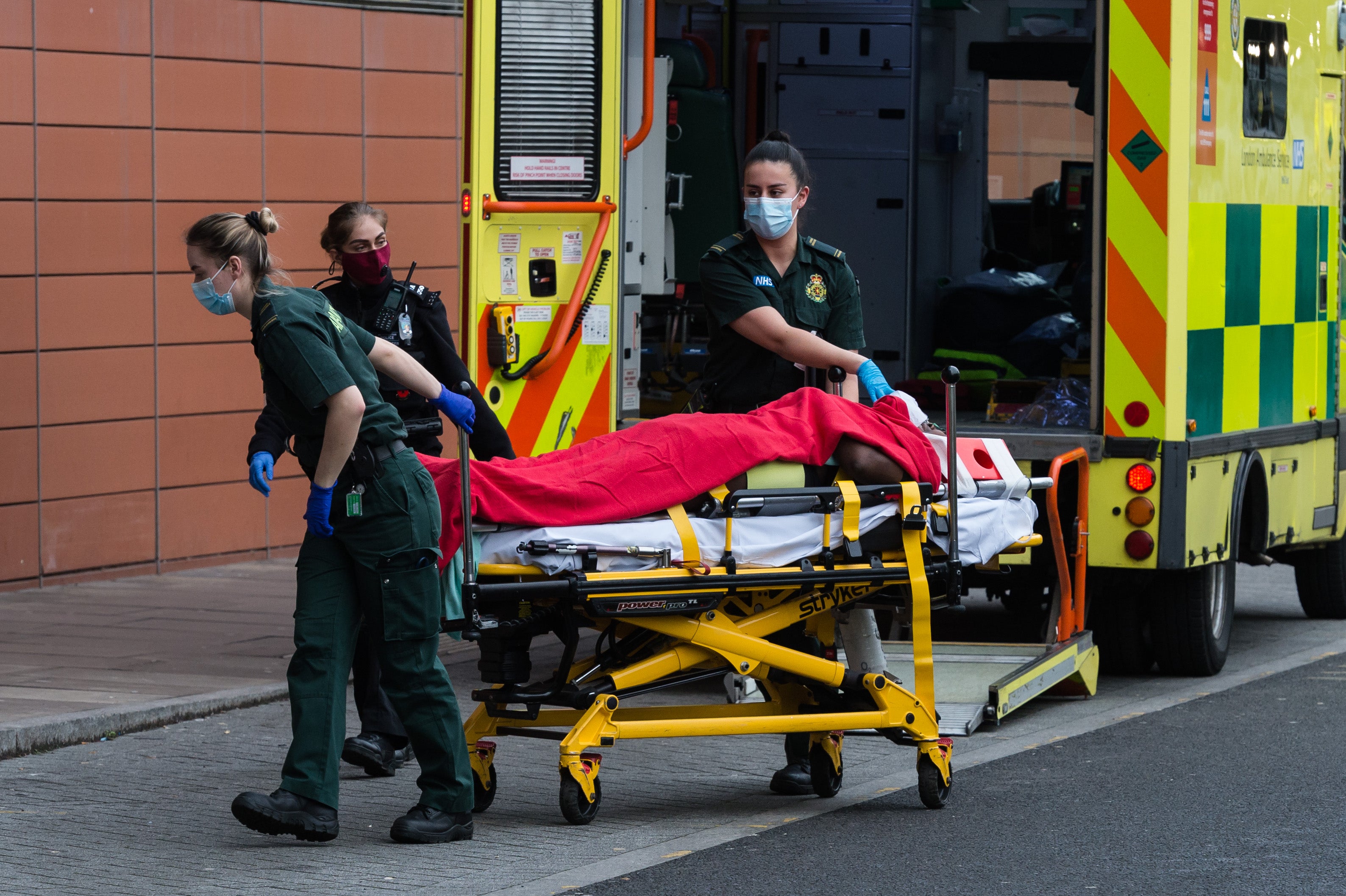 Paramedics take a Covid patient into Royal London Hospital