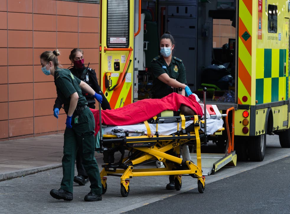 <p>Paramedics take a Covid patient into Royal London Hospital</p>