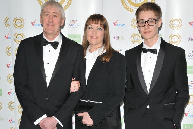 <p>Archie (far right) with his father Nicholas Lyndhurst and mother Lucy Smith in 2017</p>