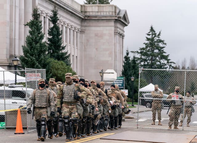 <p>Members of the National Guard leave the perimeter of the Washington State Capitol while providing extra security in Olympia, Washington, USA, 17 January 2021.&nbsp;</p>