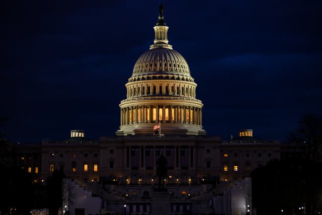 <p>The US Capitol and the stages built for the Presidential Inauguration ceremony on 17 January 2021 in Washington, DC. After last week's riots at the U.S. Capitol Building, the FBI has warned of additional threats in the nation's capital and in all 50 states.</p>