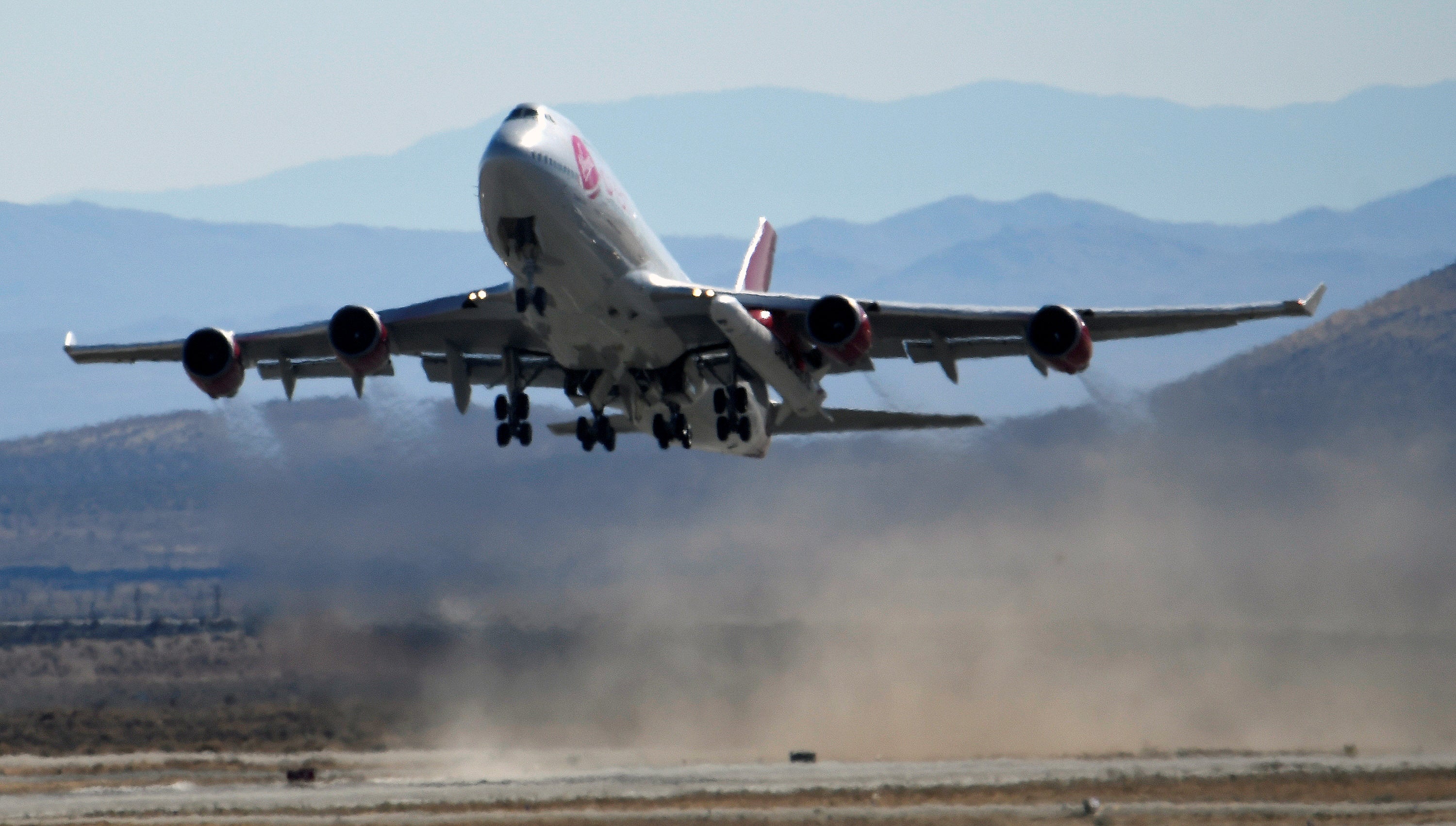 Virgin Orbit, a modified Boeing 747 jetliner carrying a rocket under its wing, during a test launch in Mojave, California
