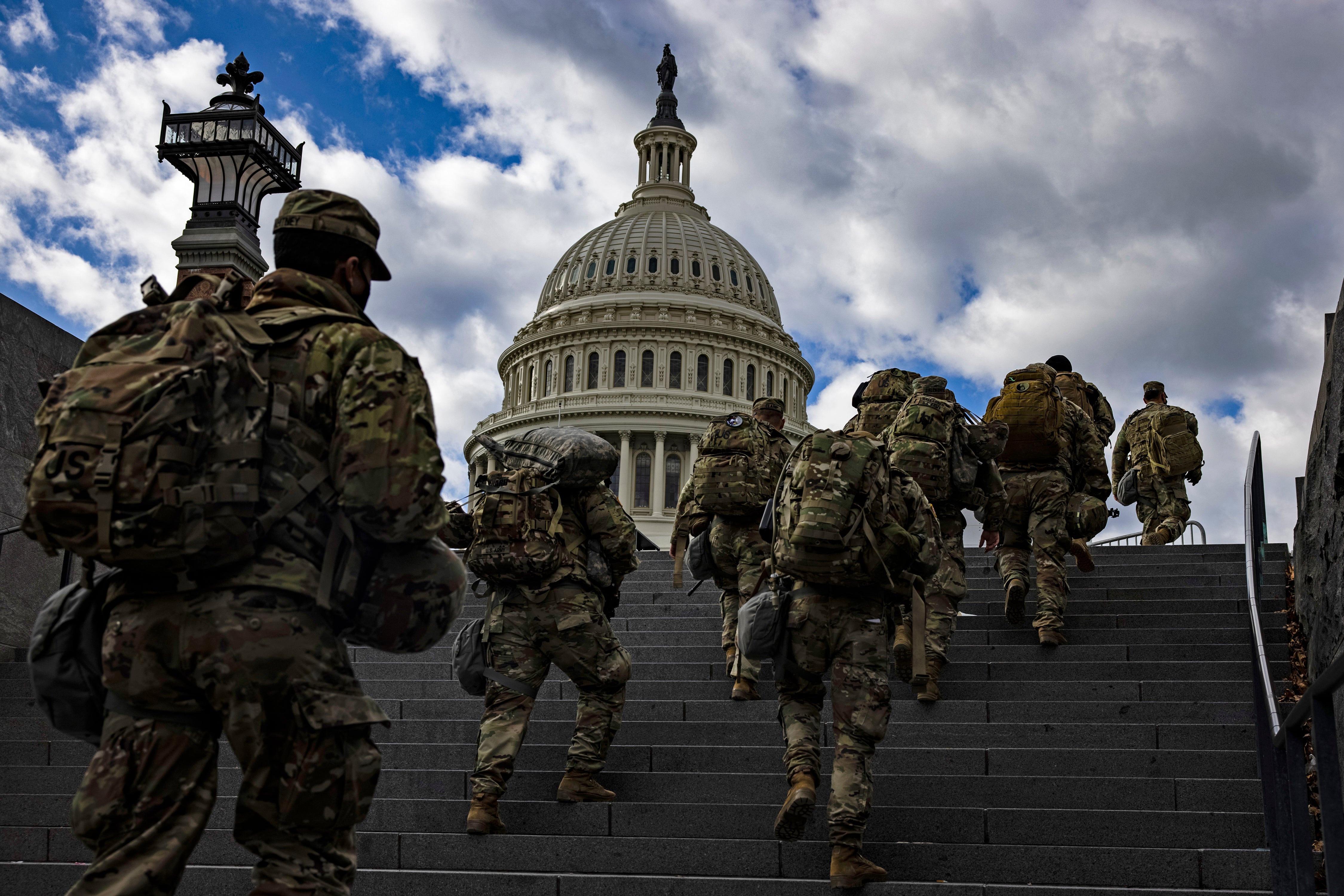 WASHINGTON, DC - JANUARY 17: National Guard soldier head to the east front of the U.S. Capitol from the Capitol Visitors Center on January 17, 2021 in Washington, DC. After last week's riots at the U.S. Capitol Building, the FBI has warned of additional threats in the nation's capital and in all 50 states. According to reports, as many as 25,000 National Guard soldiers will be guarding the city as preparations are made for the inauguration of Joe Biden as the 46th U.S. President. (Photo by Samuel Corum/Getty Images)
