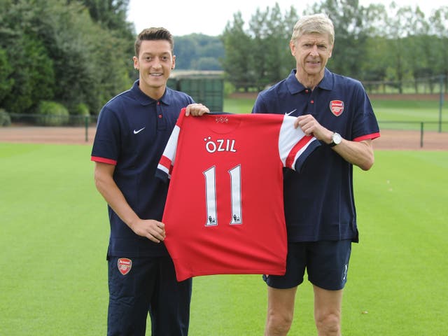 Mesut Ozil is unveiled by Arsene Wenger