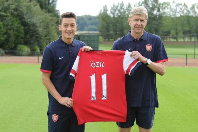Mesut Ozil is unveiled by Arsene Wenger