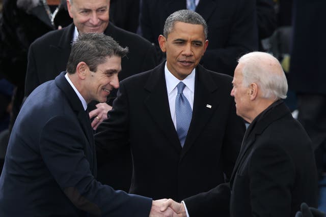 Richard blanco is greeted by then-Vice President Joe Biden and then-President Barack Obama after reciting his poem during the presidential inauguration on 21 January 2013 at the US Capitol in Washington, DC