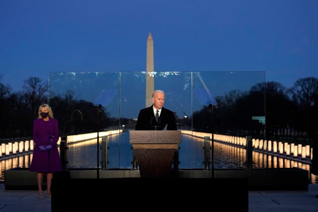 <p>President-elect Joe Biden speaks during a Covid-19 memorial, with lights placed around the Lincoln Memorial Reflecting Pool, Tuesday, Jan. 19, 2021, in Washington</p>
