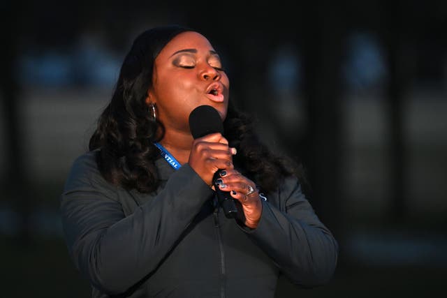 <p>Covid nurse Lori Marie Key sings ‘Amazing Grace’ at Covid-19 memorial on inauguration eve</p>