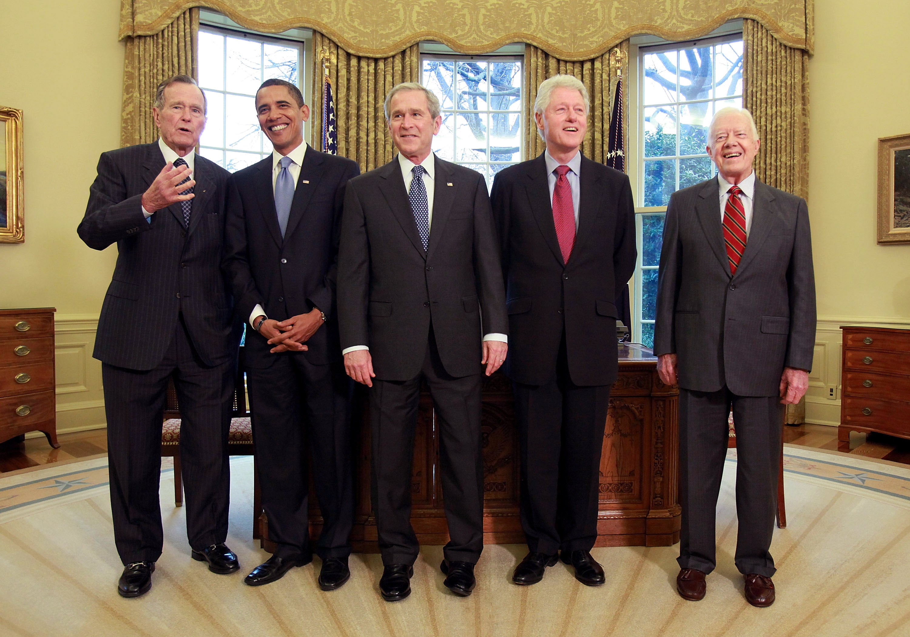 U.S. President George W. Bush meets with President-elect Barack Obama, former President Bill Clinton, former President Jimmy Carter and former President George H.W. Bush in the Oval Office January 7, 2009 in Washington, DC