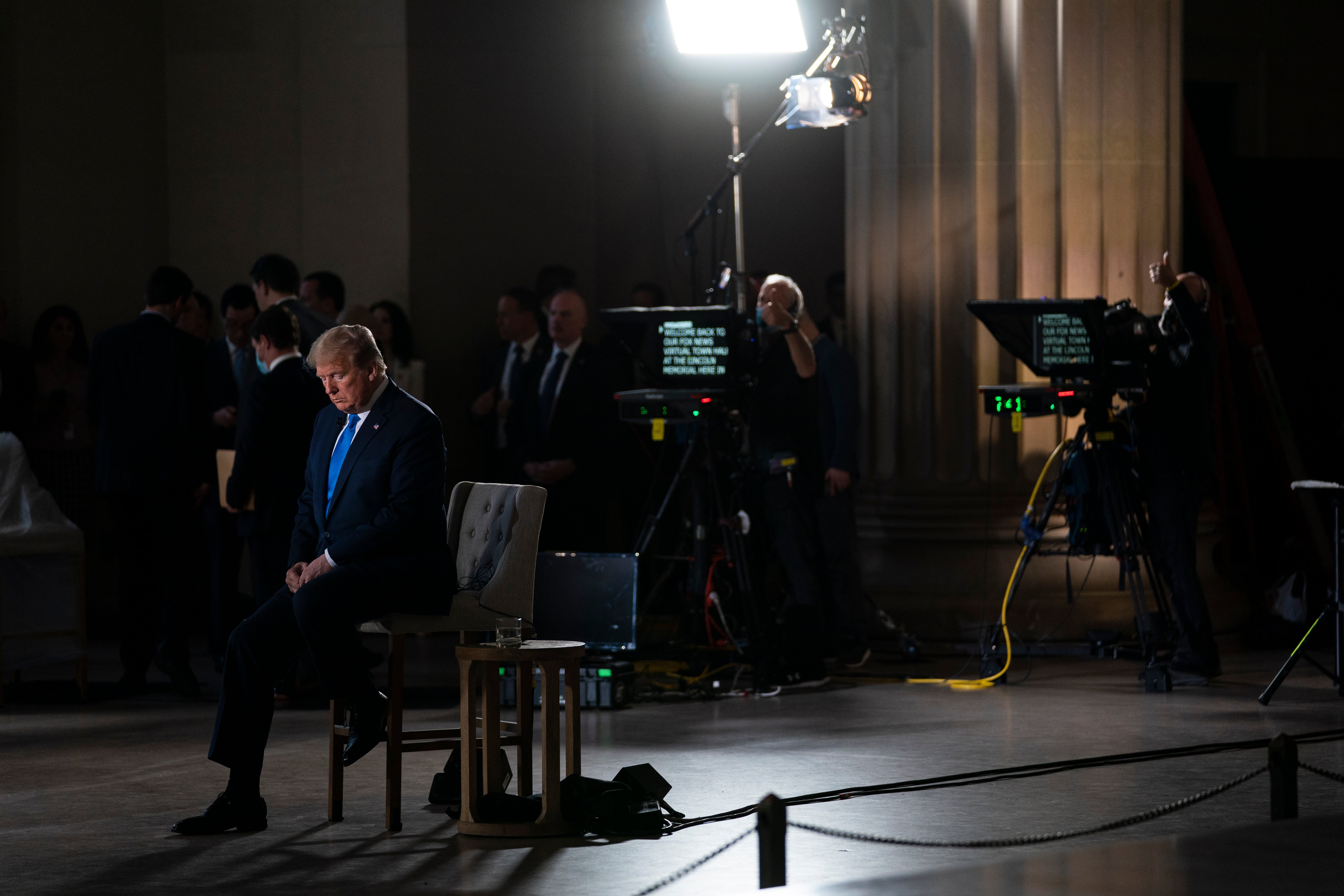 <p>File Image: In this 3 May, 2020, file photo President Donald Trump waits for a segment to start during a Fox News virtual town hall from the Lincoln Memorial in Washington.&nbsp;</p>