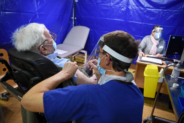 <p>Staff give AstraZeneca vaccinations to patients at a Covid-19 centre, in various cities across the UK United Kingdom.</p>