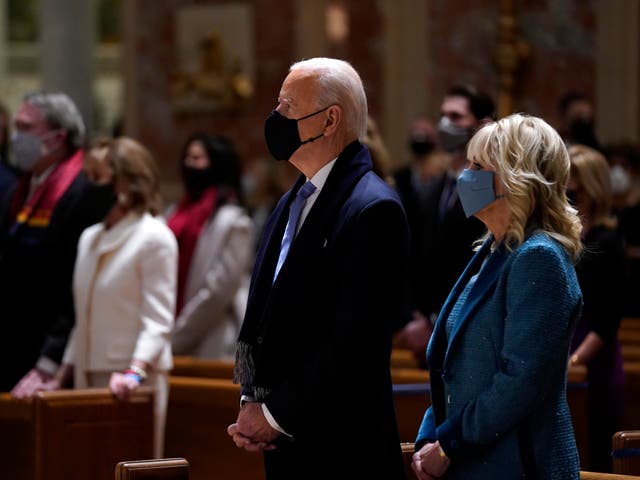 President-elect Joe Biden is joined his wife Jill Biden as they celebrate Mass at the Cathedral of St. Matthew the Apostle during Inauguration Day ceremonies Wednesday on 20 January 2021, in Washington