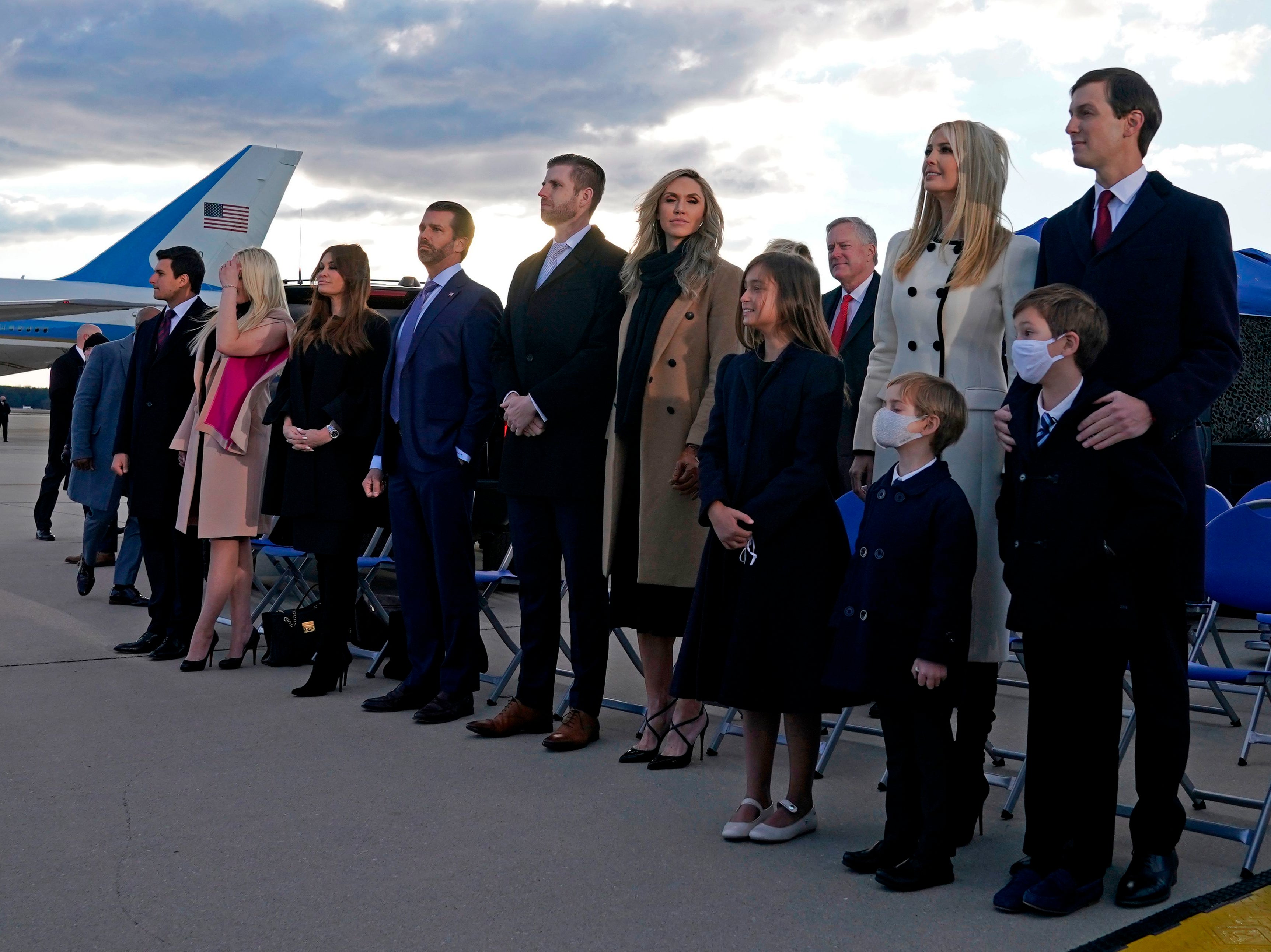 Members of Donald Trump’s family including senior advisors Ivanka Trump and Jared Kushner stand on the tarmac at Joint Base Andrews in Maryland as they arrive for US President Donald Trump's departure ceremony