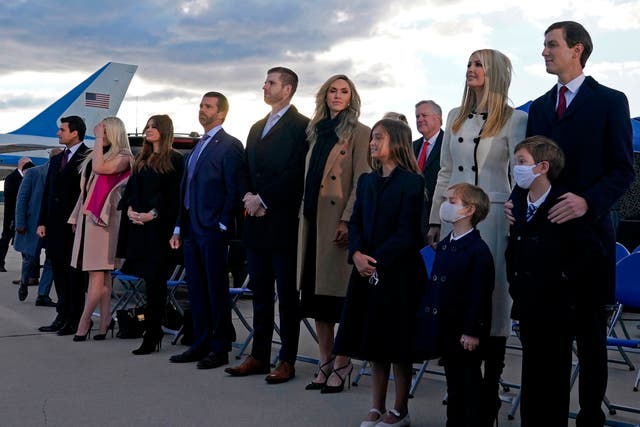 Ivanka Trump, Eric Trump, Donald Trump Jr, and Tiffany Trump stand with their respective partners on the tarmac at Joint Base Andrews in Maryland as they arrive for Donald Trump’s departure on 20 January 2021
