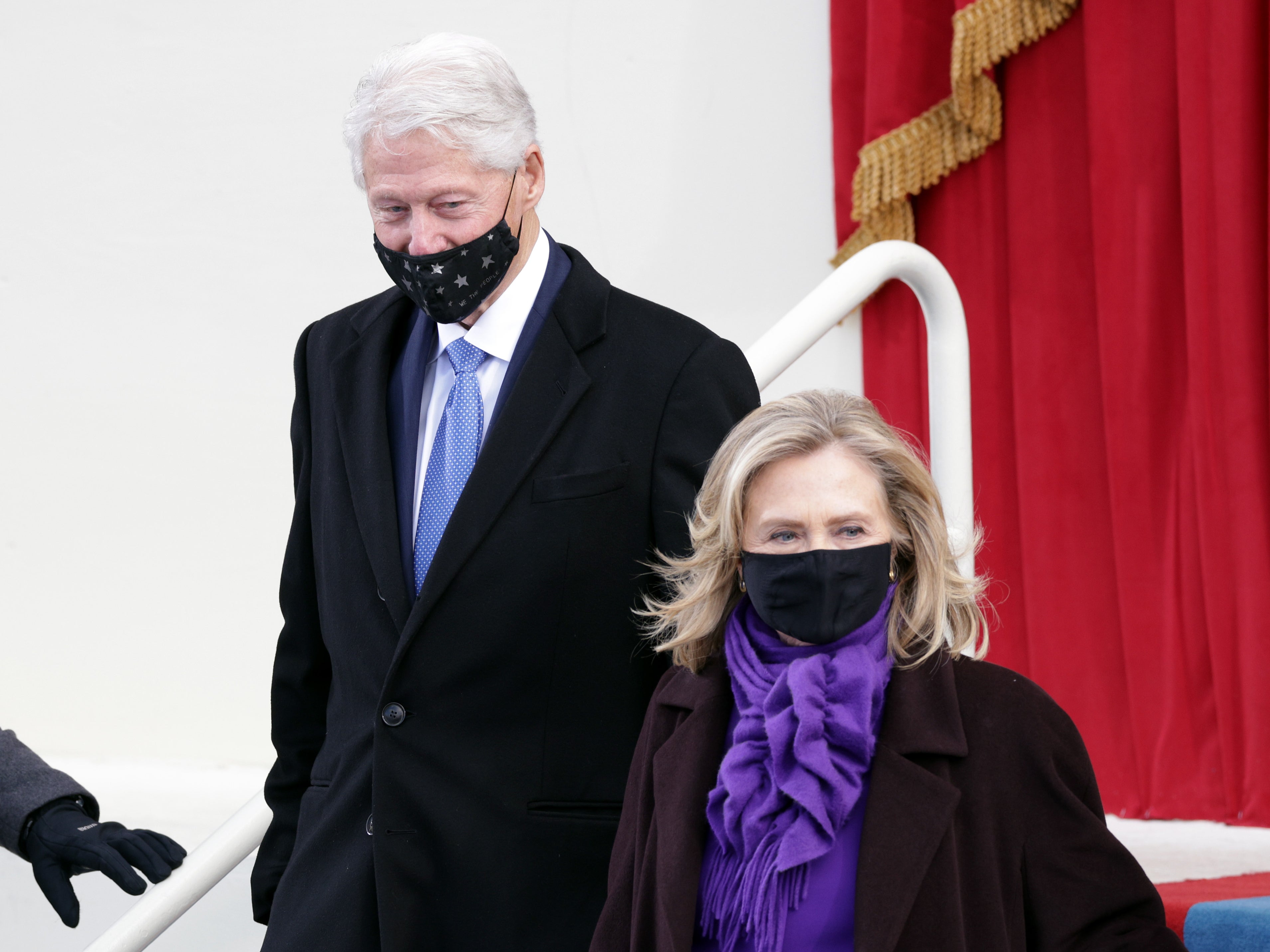Former president Bill Clinton arrives with former Secretary of State Hillary Clinton for the inauguration of Joe Biden as the 46th President of the United States on the West Front of the Capitol