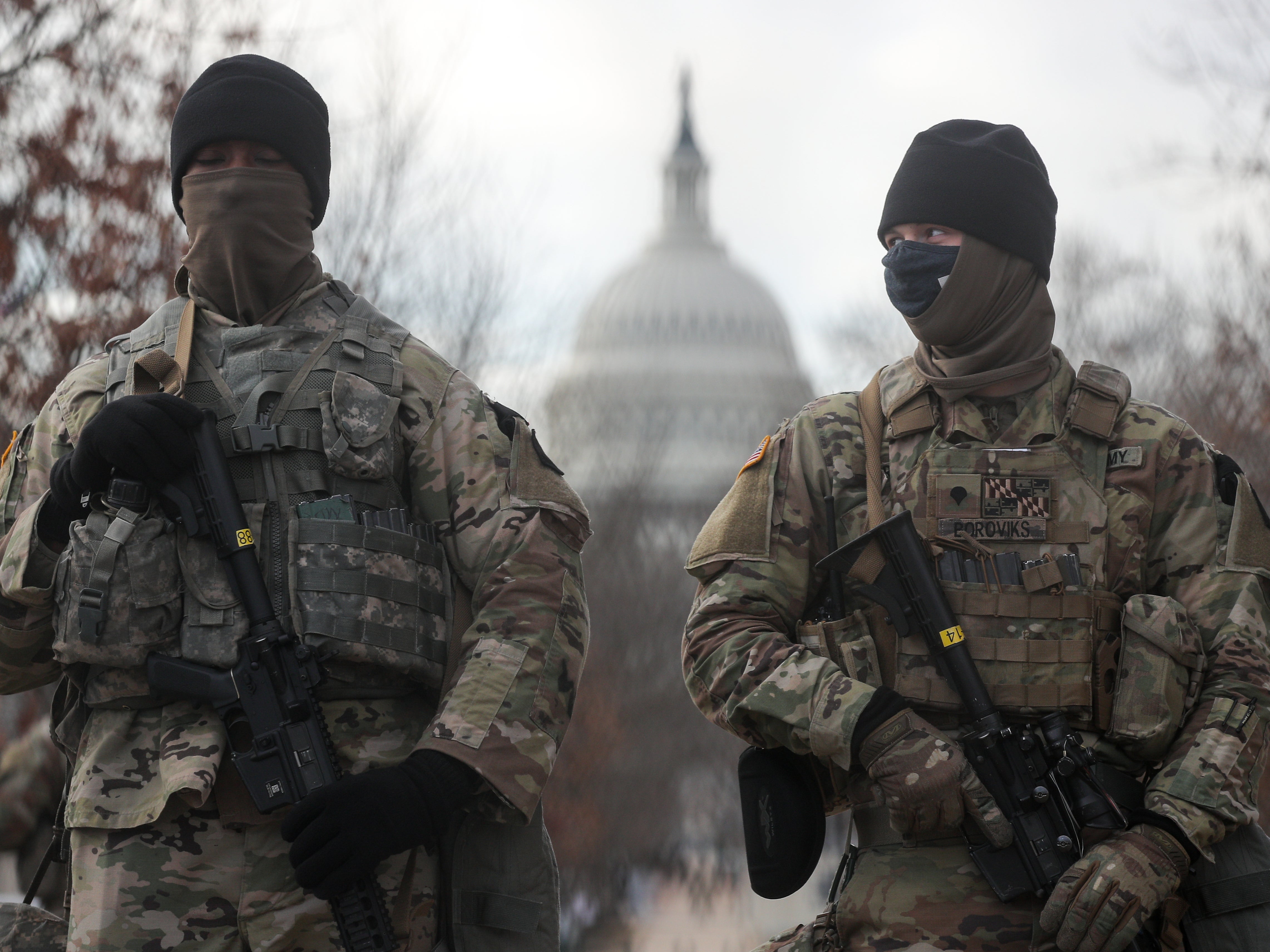 US National Guardsmen stand on a closed street outside the Capitol Building. Some 25,000 National Guard troops have been brought in from across the country to ensure security on Inauguration Day, replacing the huge crowds of tourists that would usually gather in the nation’s capital to welcome a new president