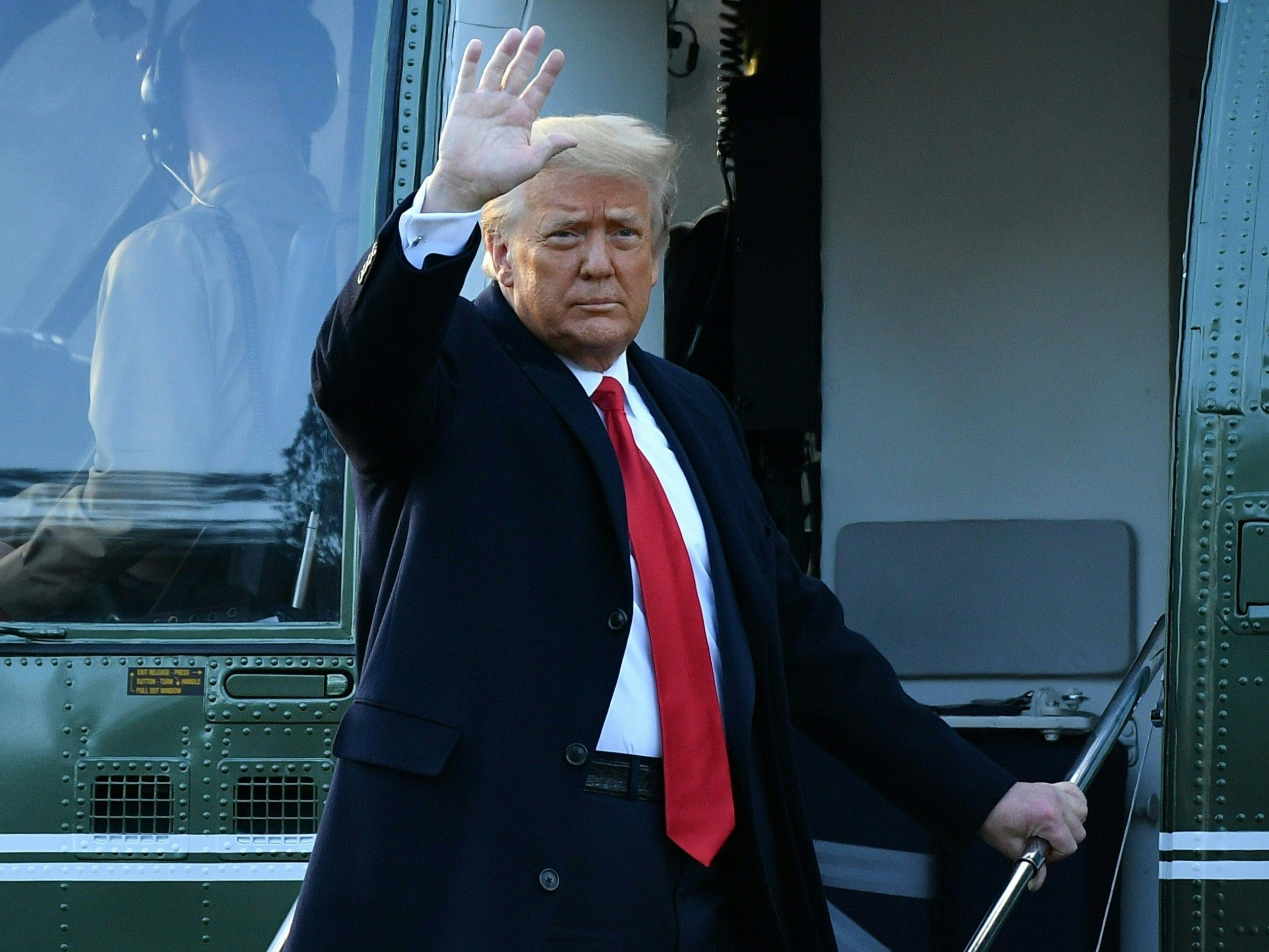 Trump waves as he boards Marine One at the White House for the last time - but will he still be a major influence on US politics?