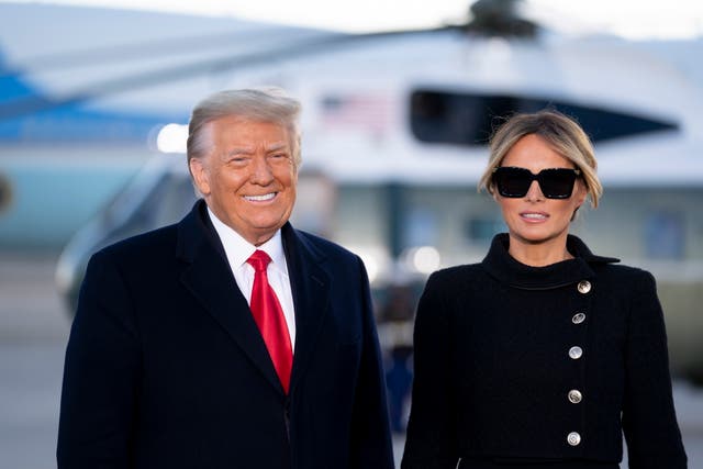 President Donald Trump, left, and First Lady Melania Trump arrive to a farewell ceremony at Joint Base Andrews