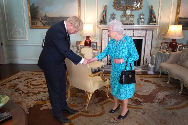 <p>The Queen shakes hands with her 14th prime minister, Boris Johnson </p>