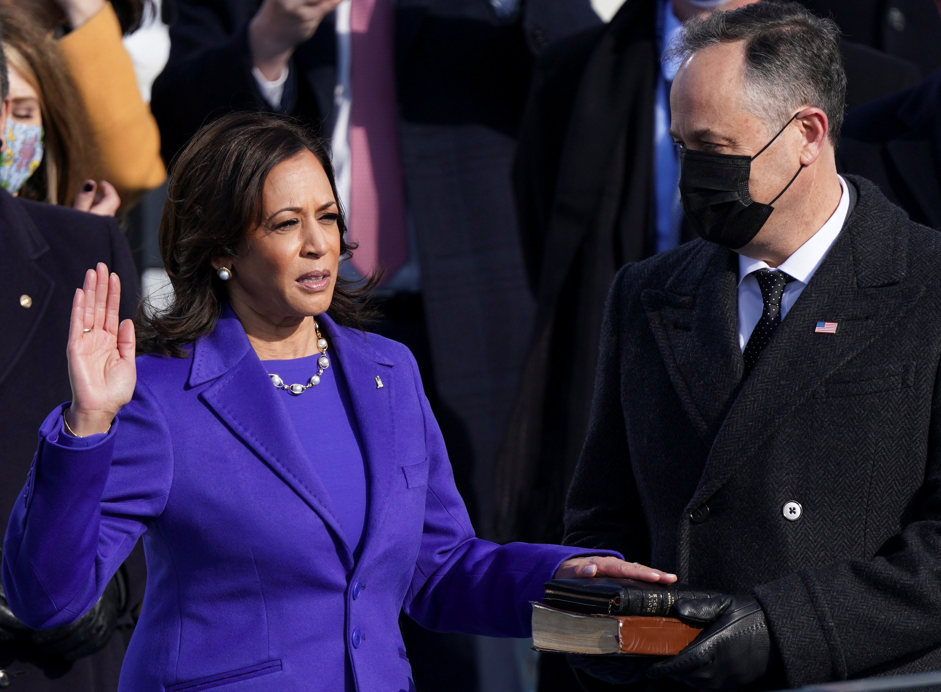 Kamala Harris is sworn in as vice president, becoming the first woman to hold the office in the nation’s history, as well as the first Black woman and first woman of South Asian descent to hold the title. Spouse Doug Emhoff holds the bible and also makes history in becoming the first ever first gentleman
