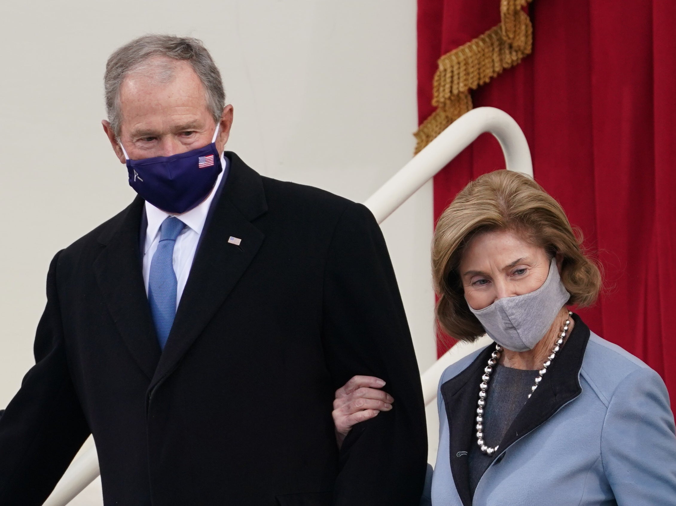 Former President George W Bush and his wife Laura Bush arrive for the inauguration ceremony of Joe Biden as the 46th President of the United States on the West Front of the Capitol