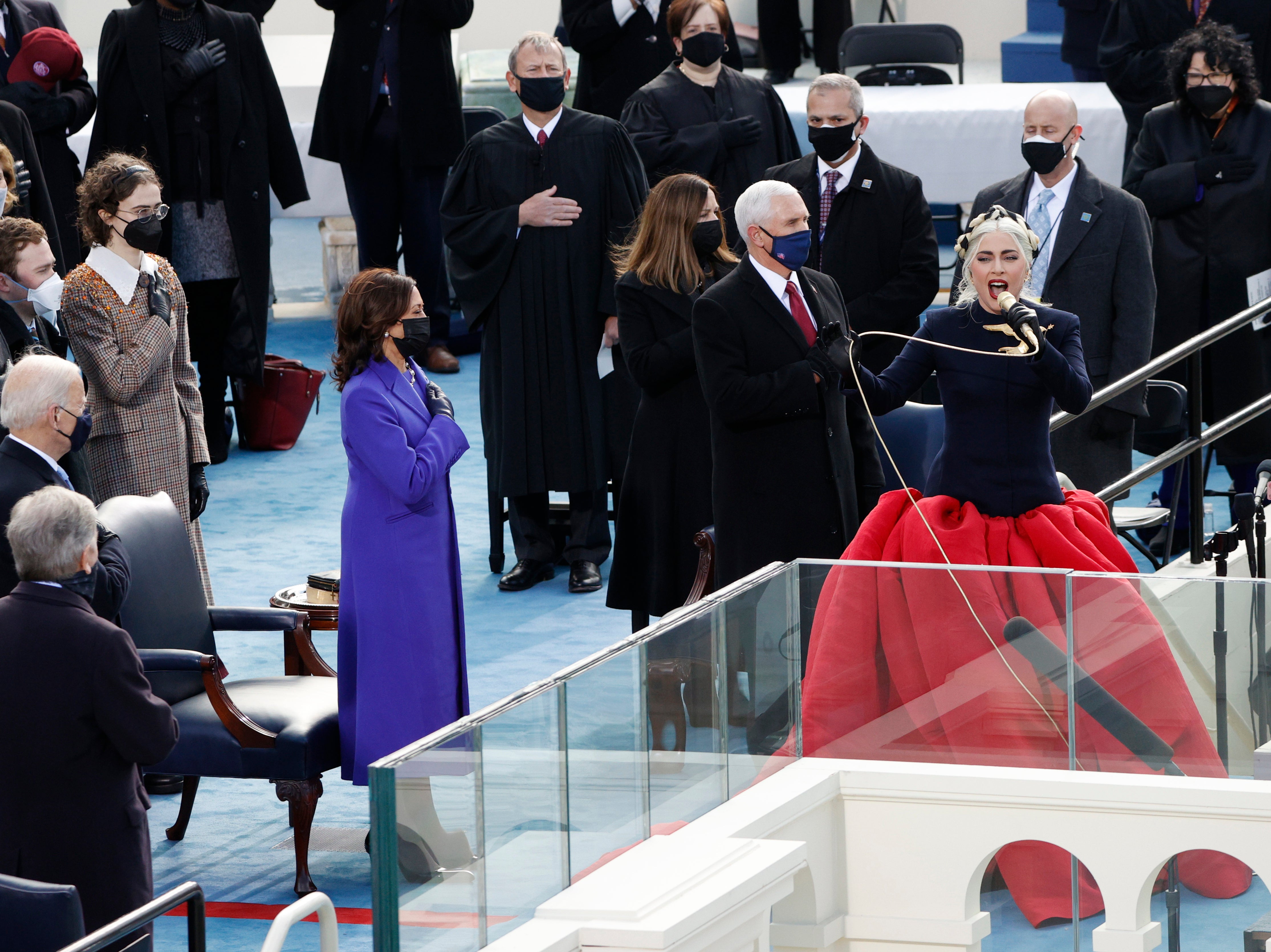 Lady Gaga sings the National Anthem during the inauguration ceremony on the West Front of the Capitol. Ahead of the inauguration on 19 January, Gaga said she hoped the ceremony would be ‘a day of peace for all Americans.’