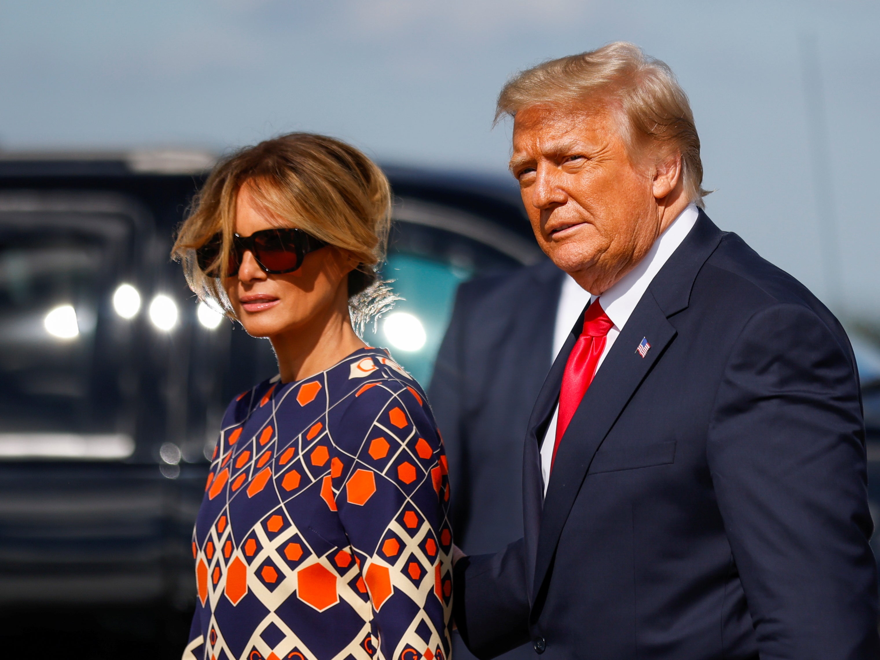 Donald Trump and Melania Trump arrive at Palm Beach International Airport in West Palm Beach, Florida after departing Washington before the inauguration ceremony of Joe Biden