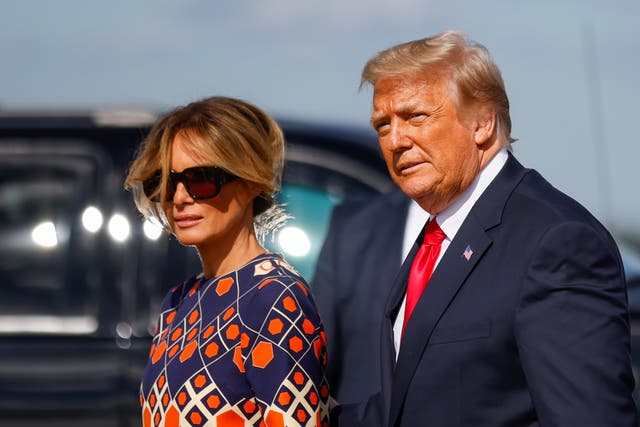 US President Donald Trump and first lady Melania Trump arrive at Palm Beach International Airport in West Palm Beach, Florida after departing Washington before the inauguration ceremony of Joe Biden