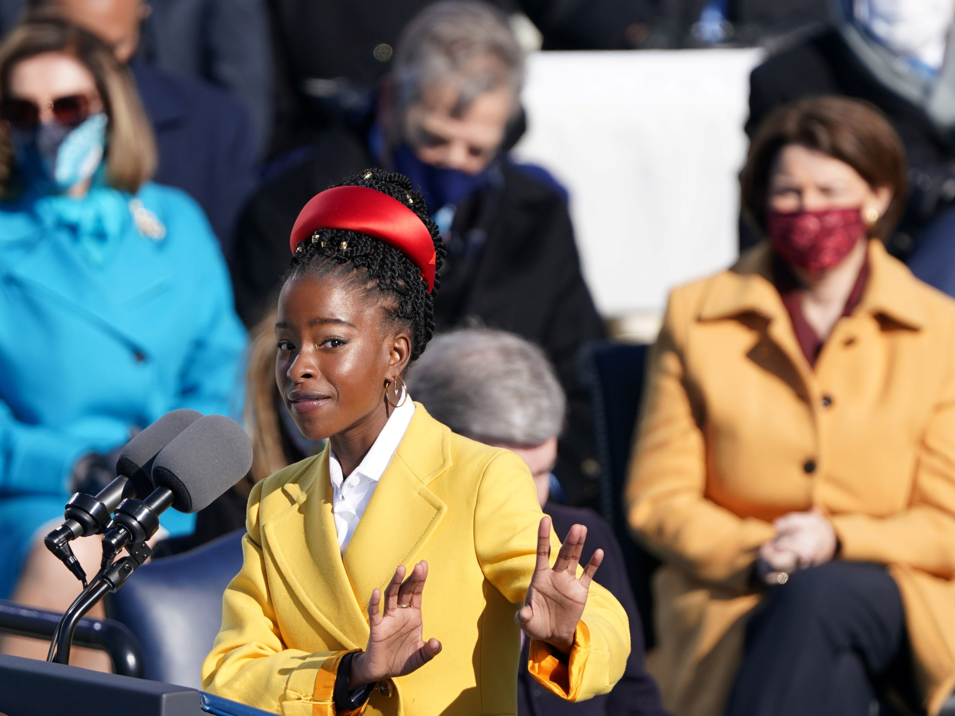 Amanda Gorman recites a poem during the inauguration of Joe Biden, referencing Biblical scripture and at times echoing the oratory of John F Kennedy and the Rev Martin Luther King Jr as she asked: ‘Where can we find light/In this never-ending shade?’