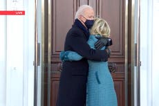 Joe Biden walks hand in hand with family to White House