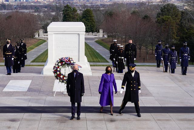 U.S. President Joe Biden, Vice President Kamala D. Harris and Major General Omar J. Jones attend a wreath laying ceremony at the Tomb of the Unknown Soldier at the Arlington National Cemetery, in Arlington, Virginia, U.S., January  20, 2021. REUTERS/Joshua Roberts/Pool