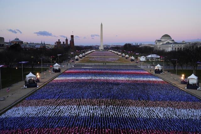 <p>The ‘Field of Flags’ and the Washington Monument are seen on the National Mall in front of the Capitol building</p>