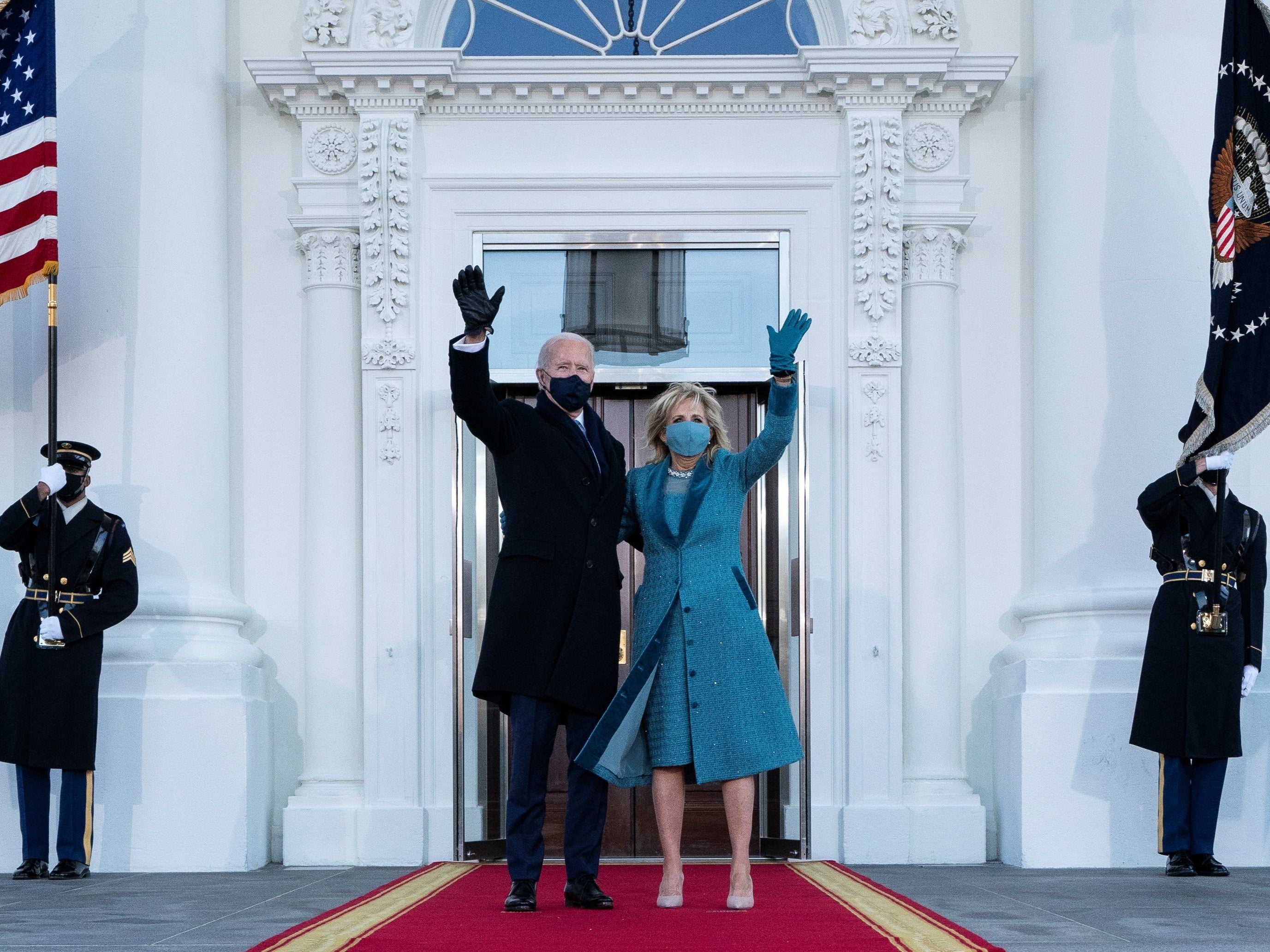 Joe Biden and Jill Biden wave as they arrive at the North Portico of the White House, which has had its 132 rooms deep cleaned since Donald Trump’s departure in light of the coronavirus pandemic