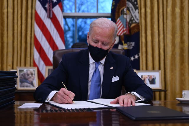 Joe Biden signs his first executive orders after being sworn in as US president