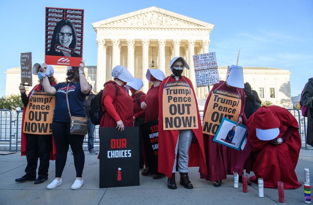 Protesters dressed in ‘The Handmaid’s Tale’-inspired costumes demonstrate outside the US Supreme Court on Capitol Hill in October, 2020