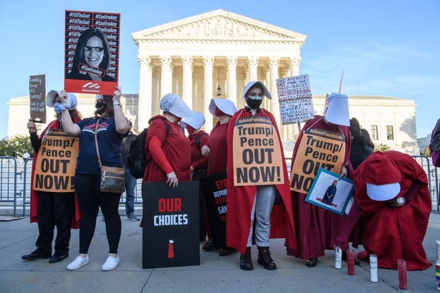 <p>Protesters dressed in ‘The Handmaid’s Tale’-inspired costumes demonstrate outside the US Supreme Court on Capitol Hill in October, 2020</p>