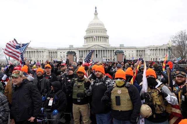 <p>Members of the far-right group Proud Boys gather in front of the US Capitol building</p>